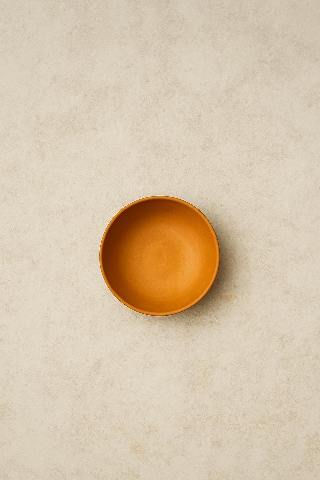 Small pottery bowl in warm clay colour for home decor
